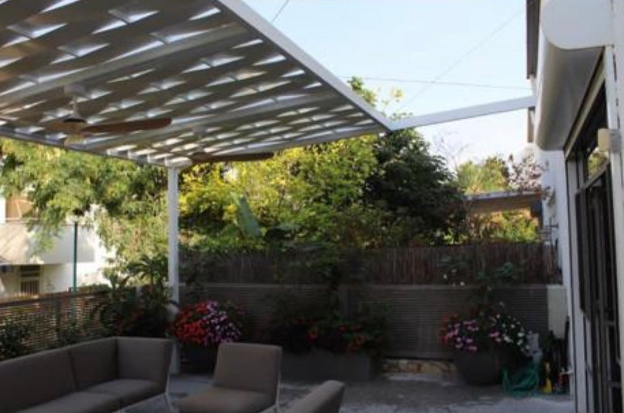 Aluminum pergola shading a patio seating area